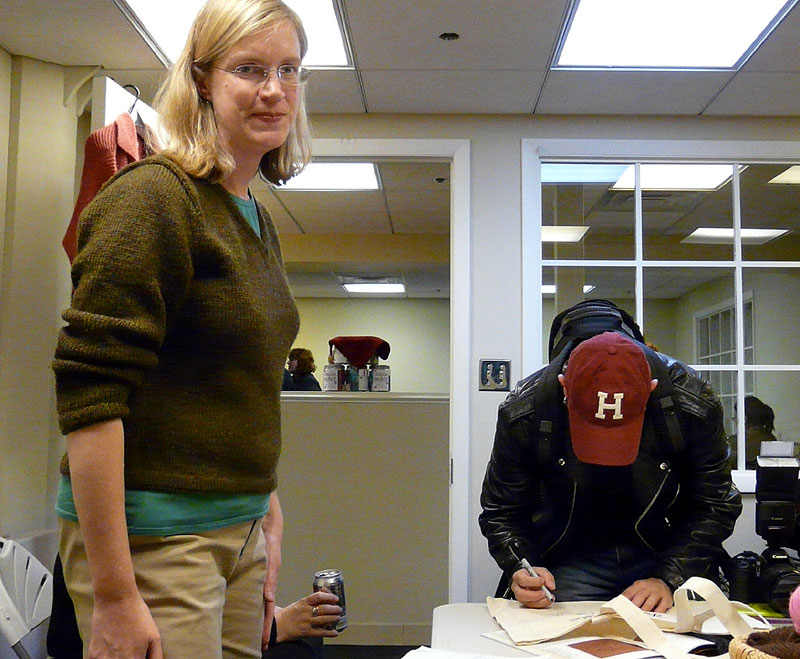 Franklin signing Ann's bag