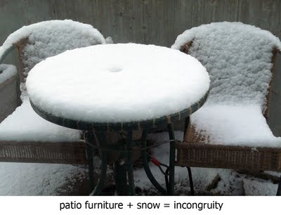 first snow on patio chairs